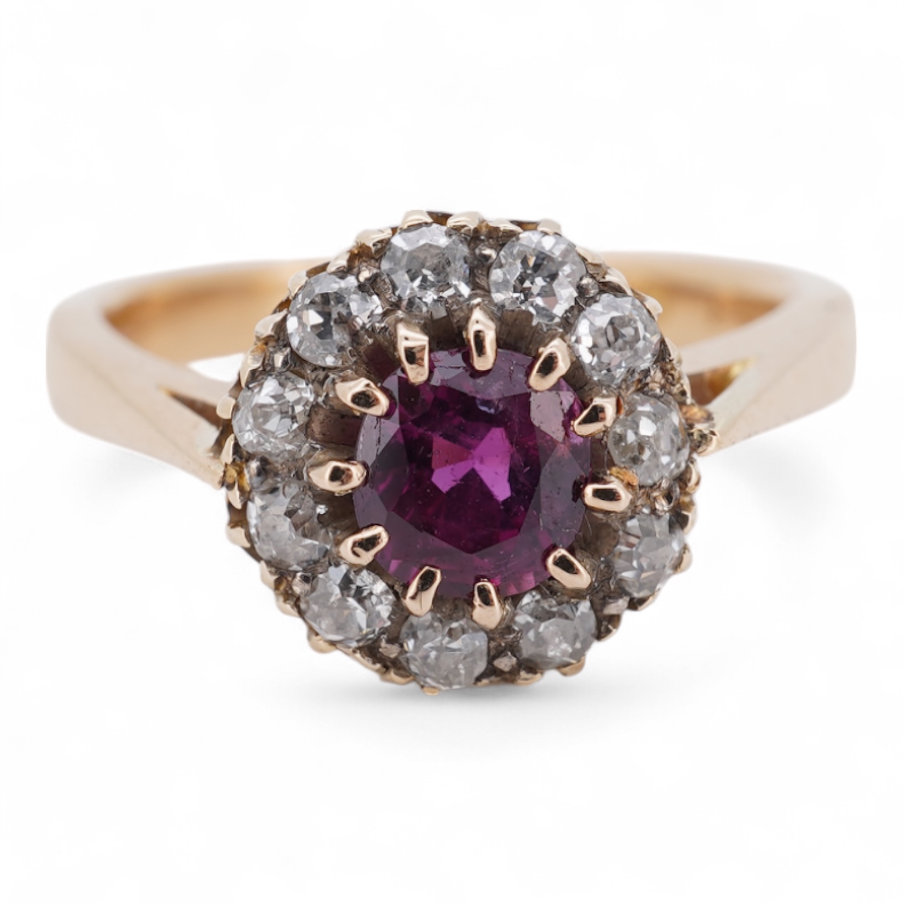 A George V 18ct gold, ruby and diamond set circular cluster ring, size M, gross weight 5 grams.